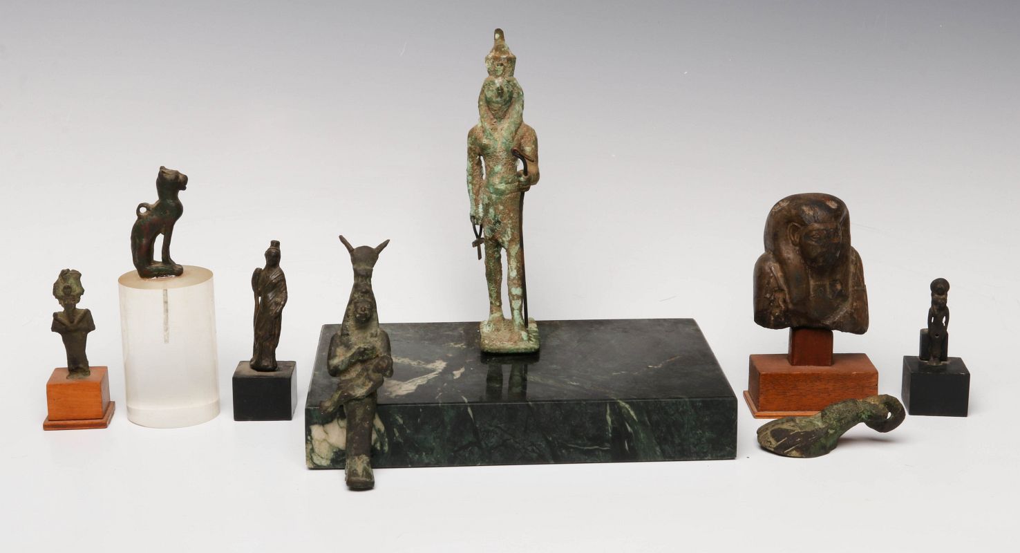 EIGHT BRONZE AND STONE ARTIFACTS OF EGYPTIAN MOTIF