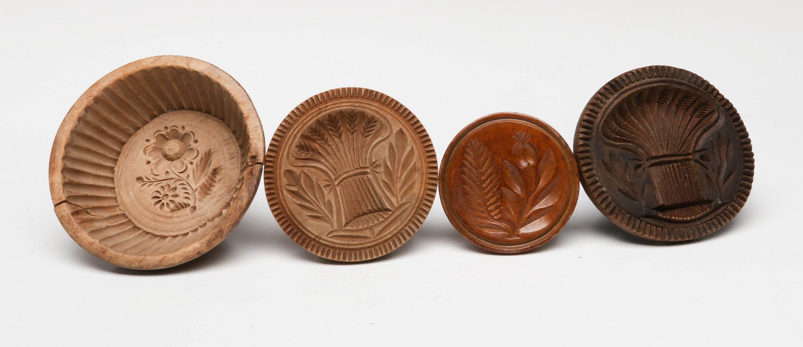 FOUR 19TH C. AMERICAN CARVED WOOD BUTTER STAMPS