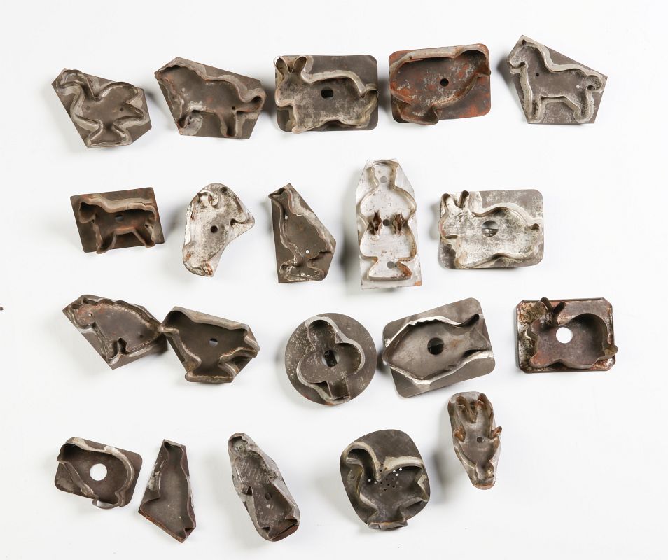 A COLLECTION OF TWENTY TIN COOKIE CUTTERS