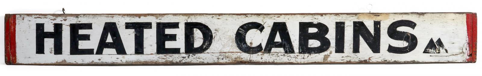 A PAINTED WOOD 'HEATED CABINS' SIGN CIRCA 1940