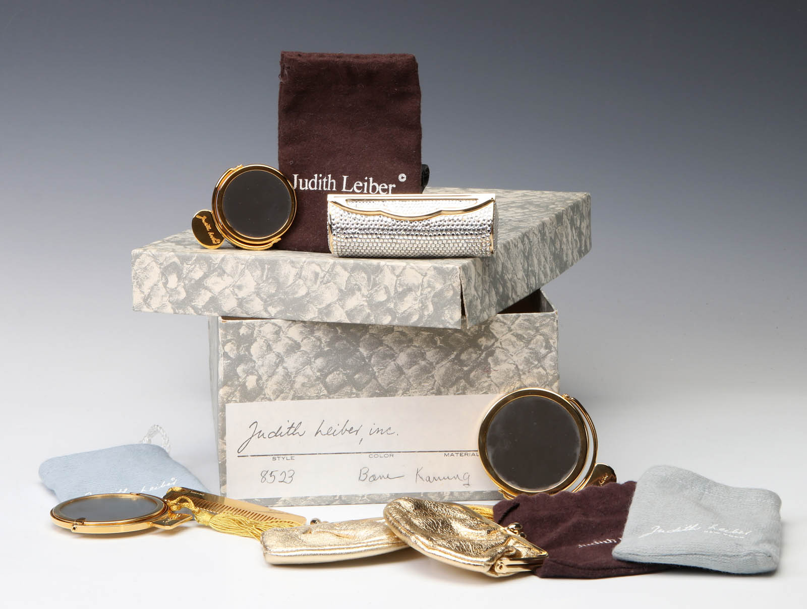 A COLLECTION OF JUDITH LEIBER PURSE ACCESSORIES