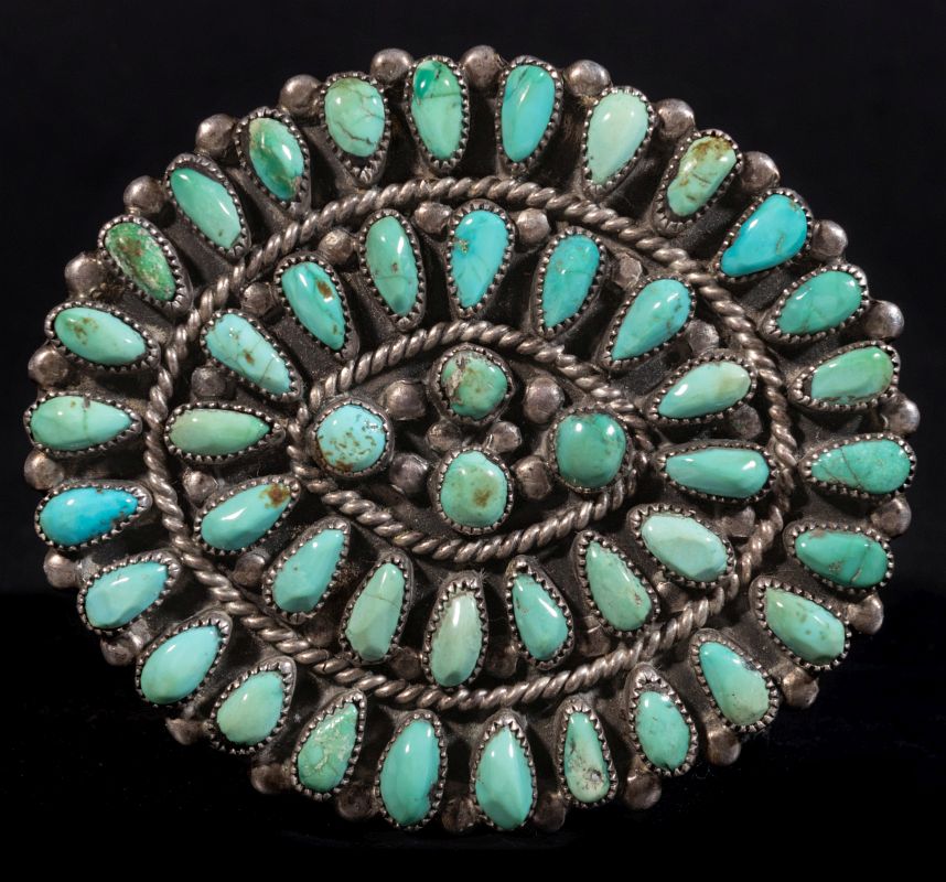 A ZUNI PETTIPOINT STERLING AND TURQUOISE BROOCH