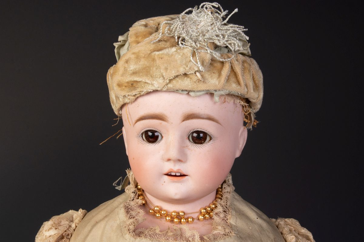 AN ANTIQUE FRENCH BISQUE HEAD FASHION DOLL