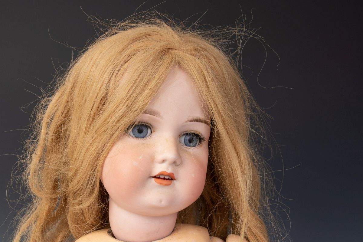 A 30-INCH BISQUE DOLL ATTRIBUTED ARMAND MARSEILLE