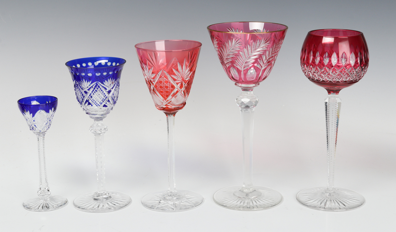 A COLLECTION OF COLORED CUT TO CLEAR CRYSTAL WINES