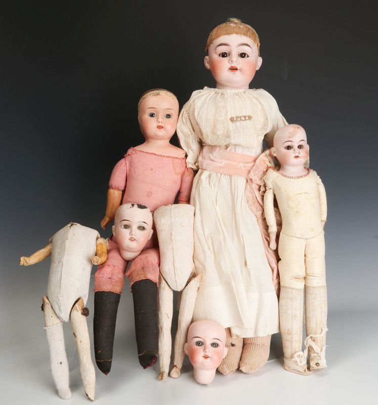A COLLECTION OF ANTIQUE GERMAN BISQUE HEAD DOLLS