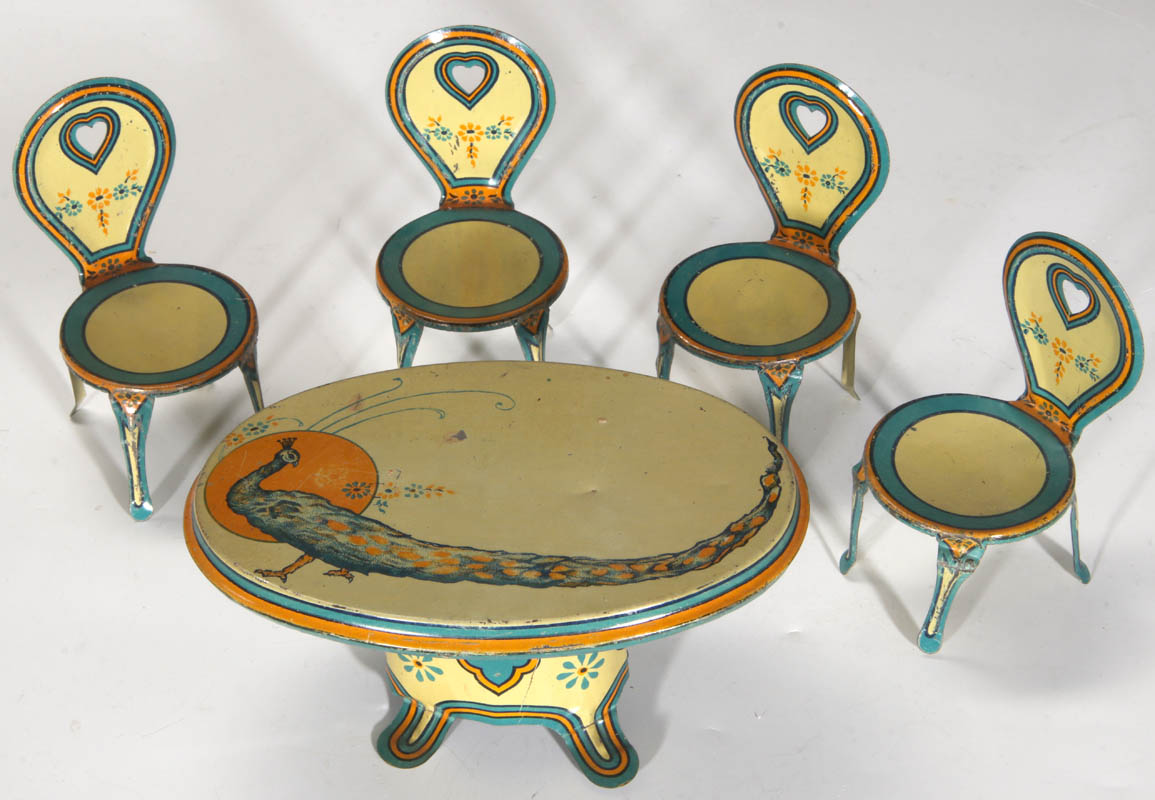 AN ANTIQUE TIN LITHO DOLL'S TABLE AND CHAIRS SET