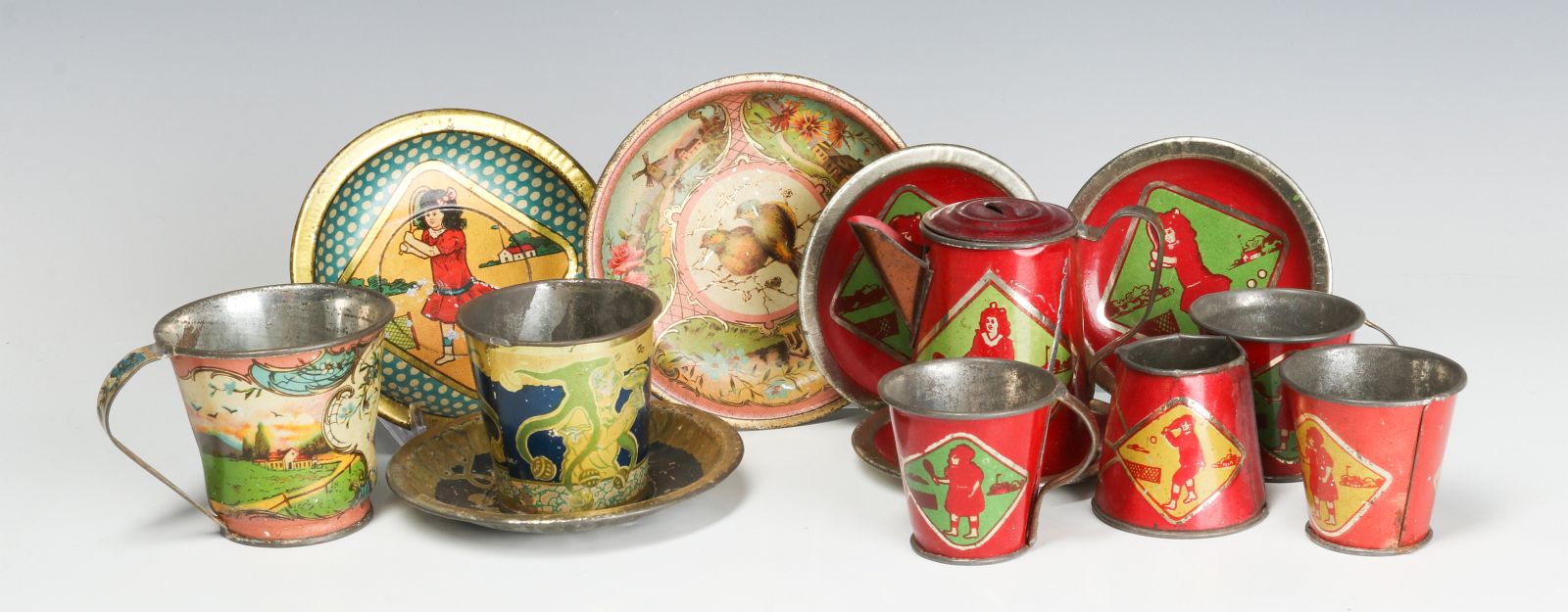 A COLLECTION OF ANTIQUE TIN LITHO TOY DISHES