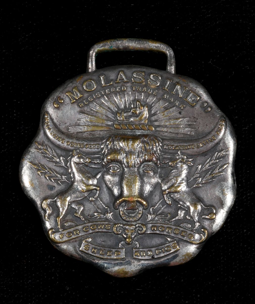 MOLASSINE MEAL ADVERTISING WATCH FOB CIRCA 1900