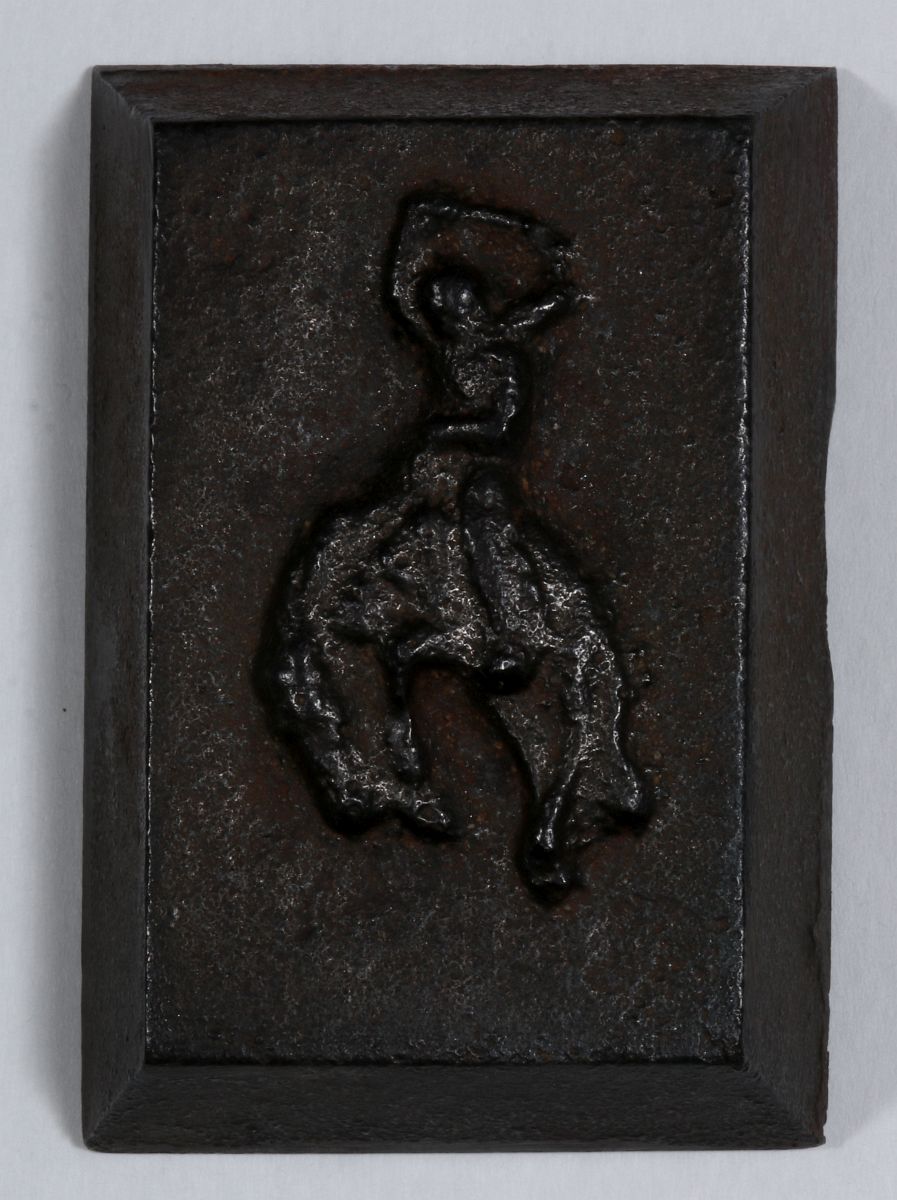 A UNIVERSITY OF WYOMING CAST IRON PAPERWEIGHT