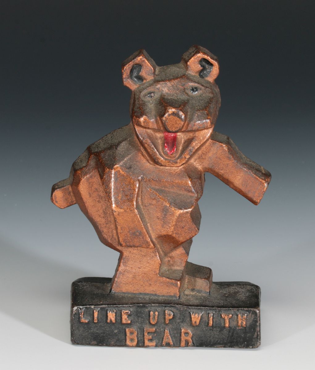 A 1920s 'LINE UP WITH BEAR' ADVERTISING PAPERWEIGHT