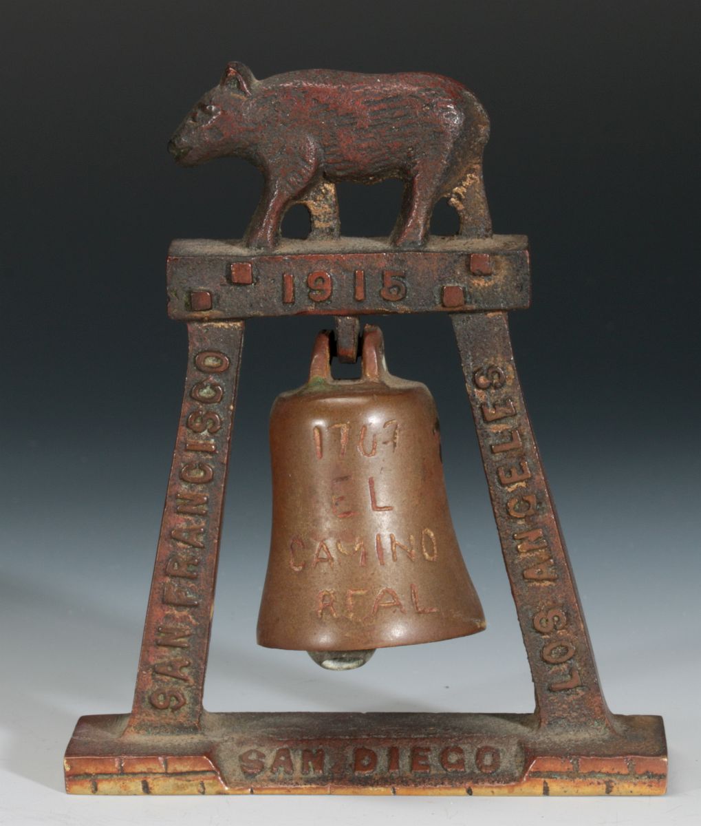 A 1915 CALIFORNIA MISSION BELL SOUVENIR PAPERWEIGHT