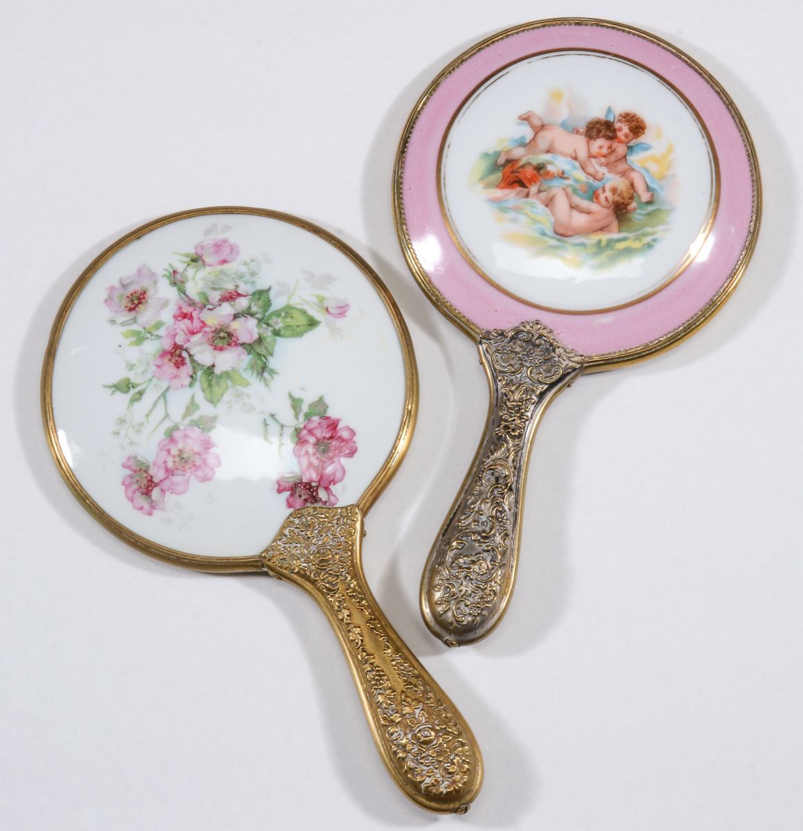 TWO ANTIQUE HAND MIRRORS WITH PAINTED PORCELAINS