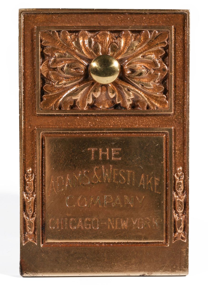 AN ADAMS AND WESTLAKE COMPANY BRASS PAPERWEIGHT