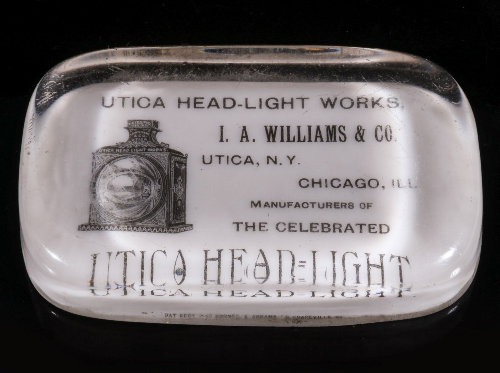 A UTICA HEADLIGHT WORKS FUSED GLASS PAPERWEIGHT