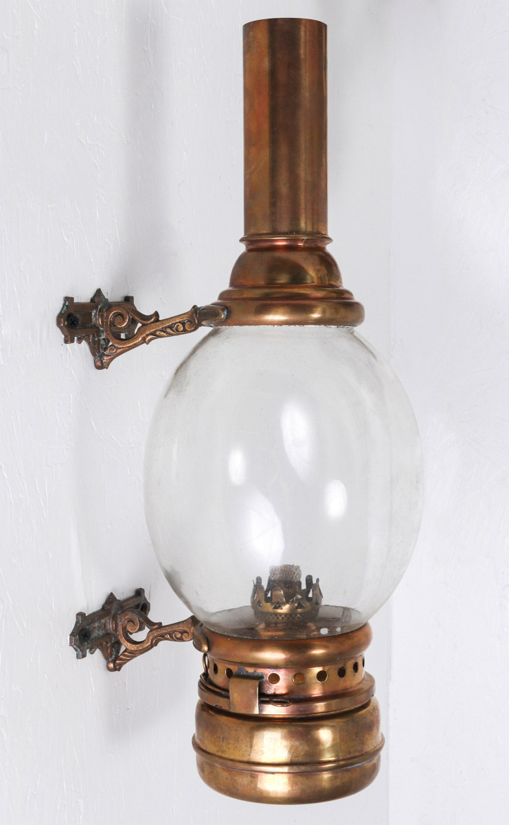 A 19TH CENTURY ORNATE BRASS RAILCAR SIDE LAMP