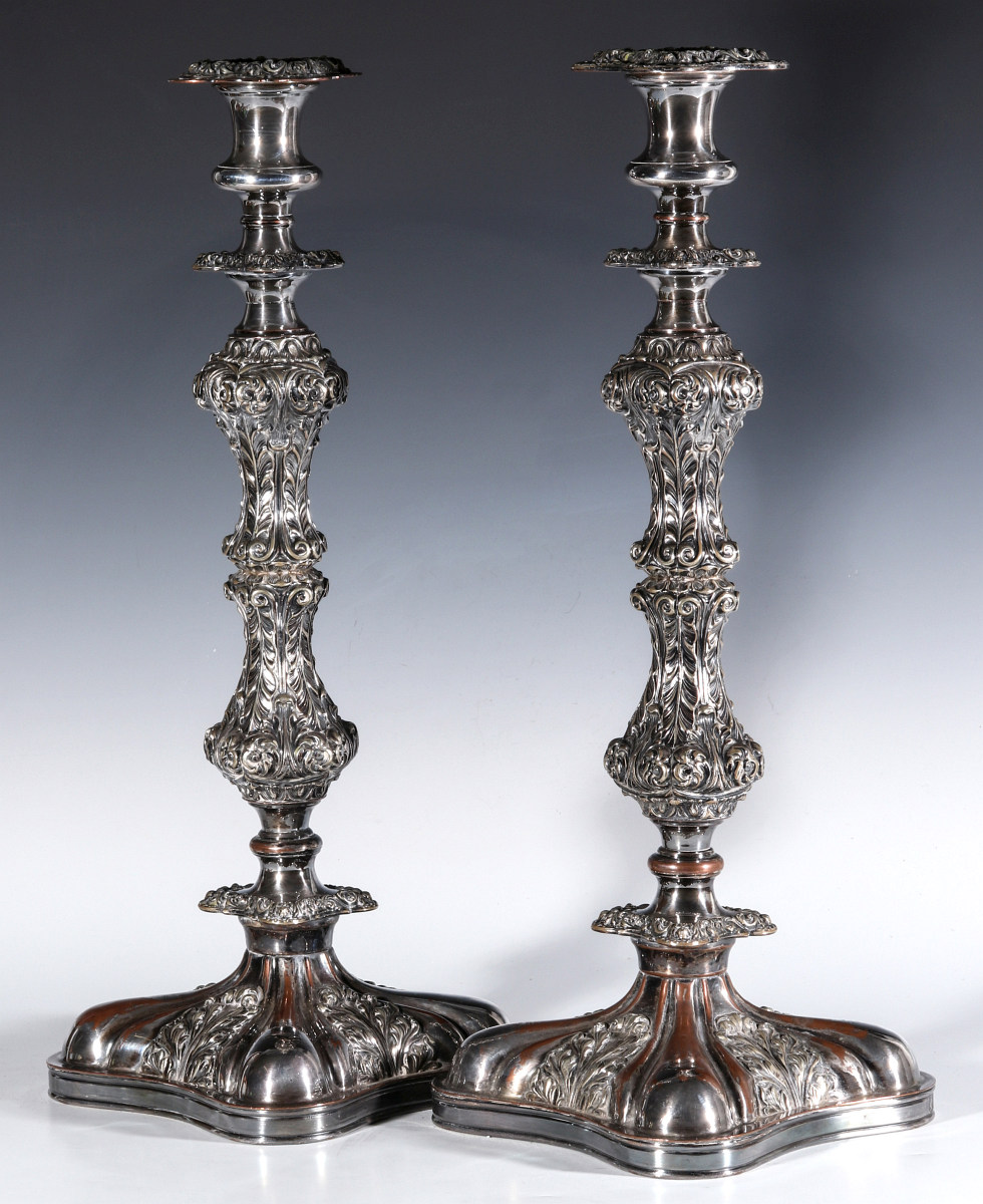 A PAIR ENGLISH SILVER PLATED ROCOCO CANDLESTICKS
