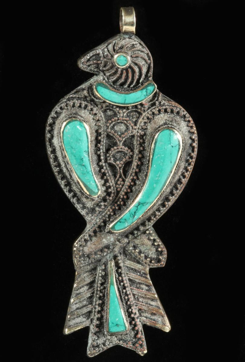 A NAVAJO THUNDERBIRD PENDANT WITH TURQUOISE
