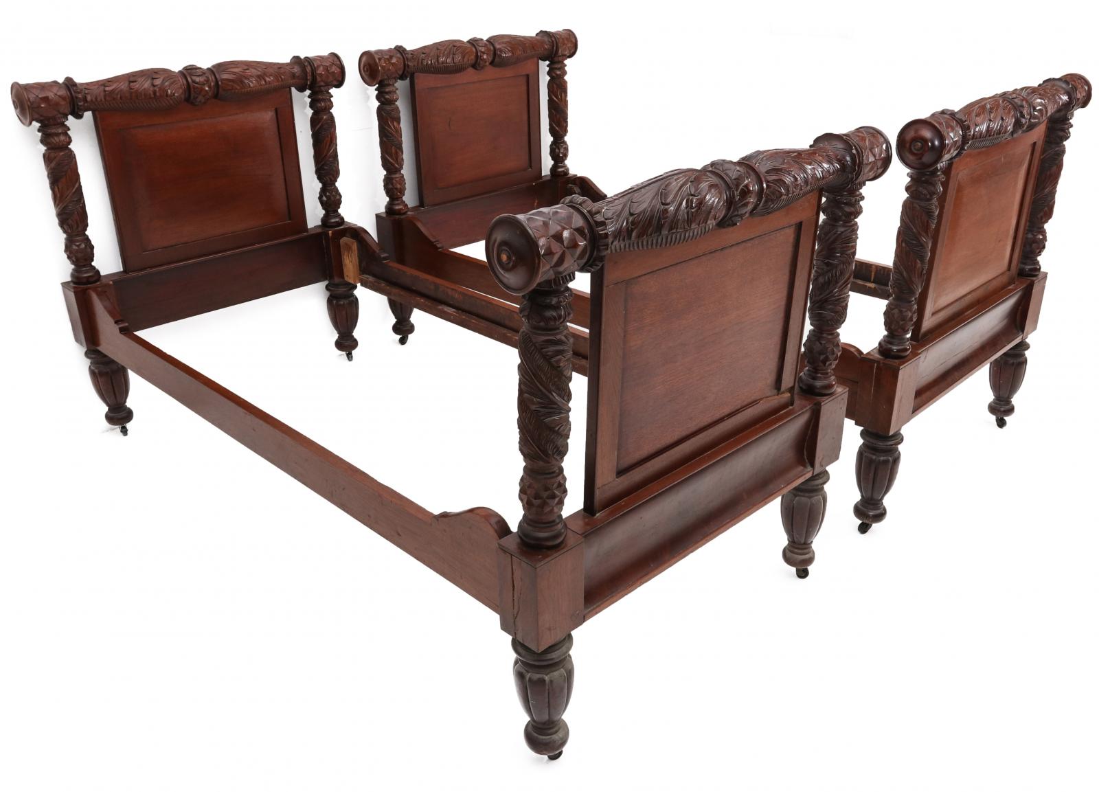 A PAIR 19TH C AMERICAN HEAVILY CARVED SLEIGH BEDS