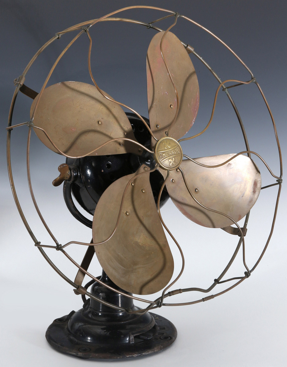 AN EMERSON ELECTRIC TABLE FAN WITH YOKE CIRCA 1912