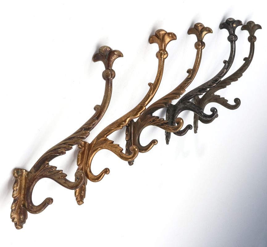 A COLLECTION OF ADLAKE RAILCAR COAT AND HAT HOOKS