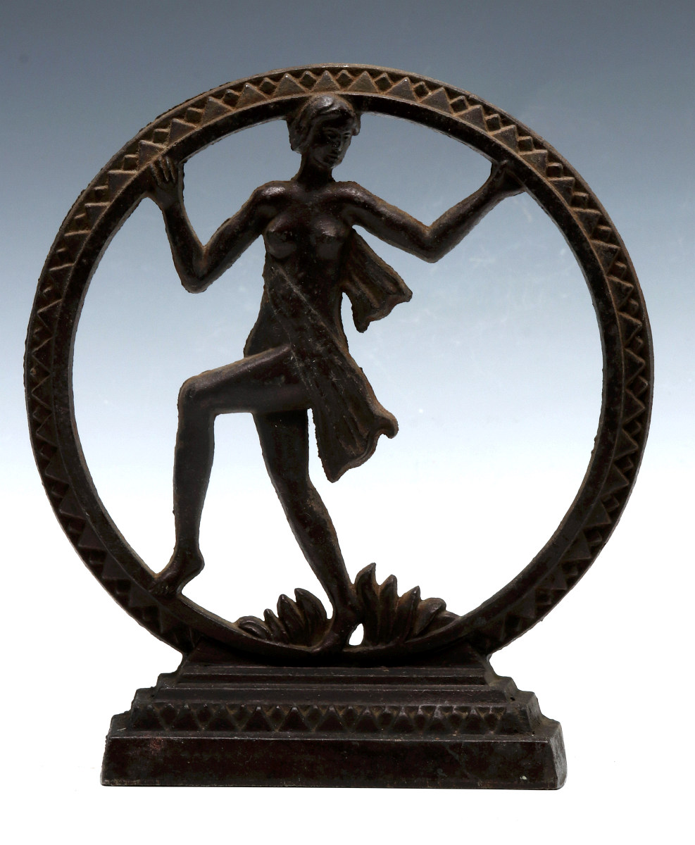 AN ART DECO CAST IRON LAMP BASE WITH NUDE DANCER