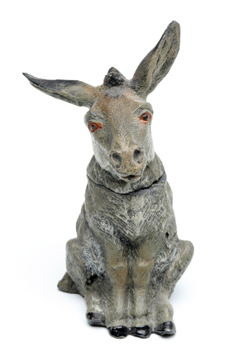 AN ANTIQUE COLD PAINTED SPELTER DONKEY INKWELL