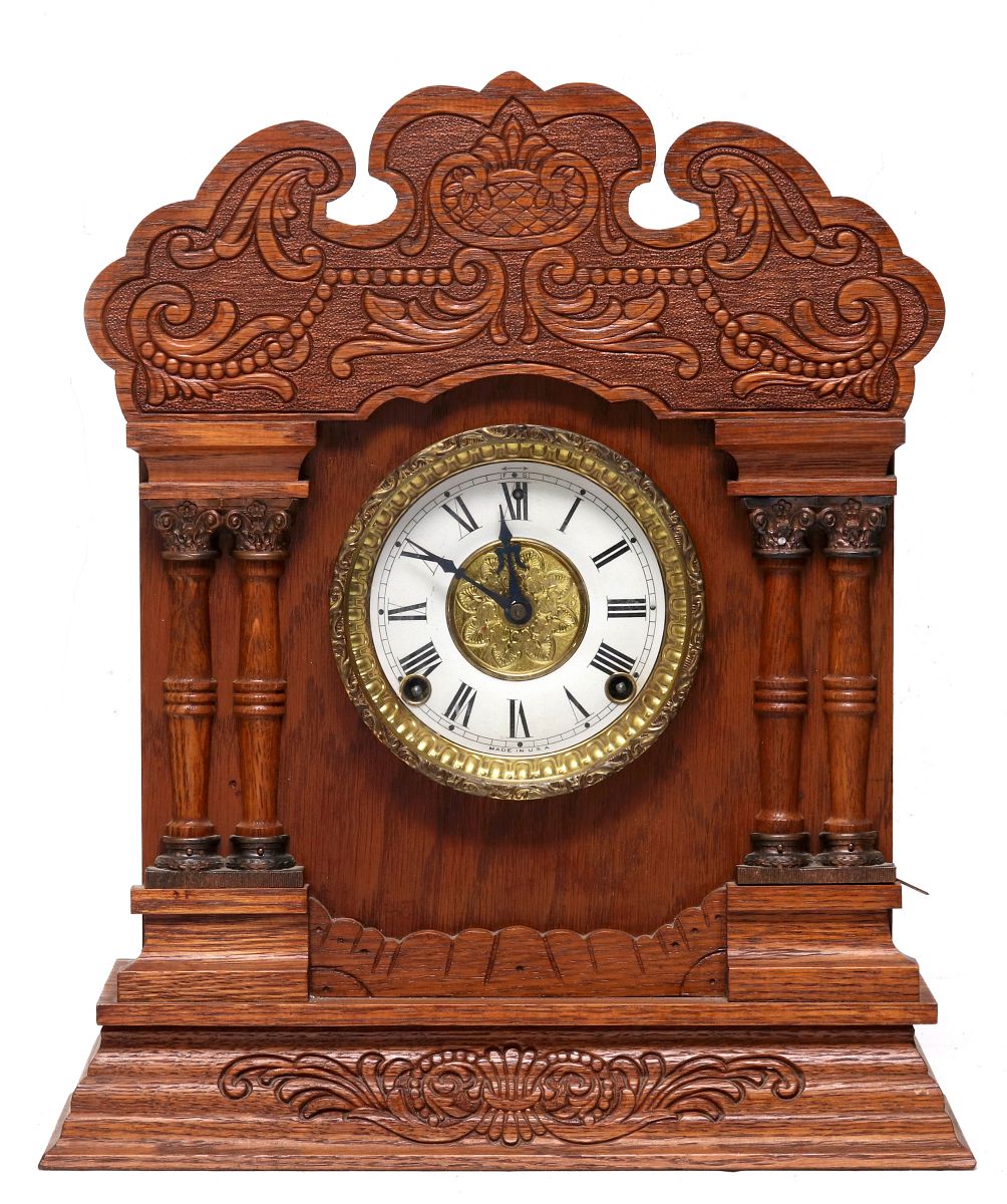 A NEW HAVEN CLOCK CO. GINGERBREAD MANTLE CLOCK