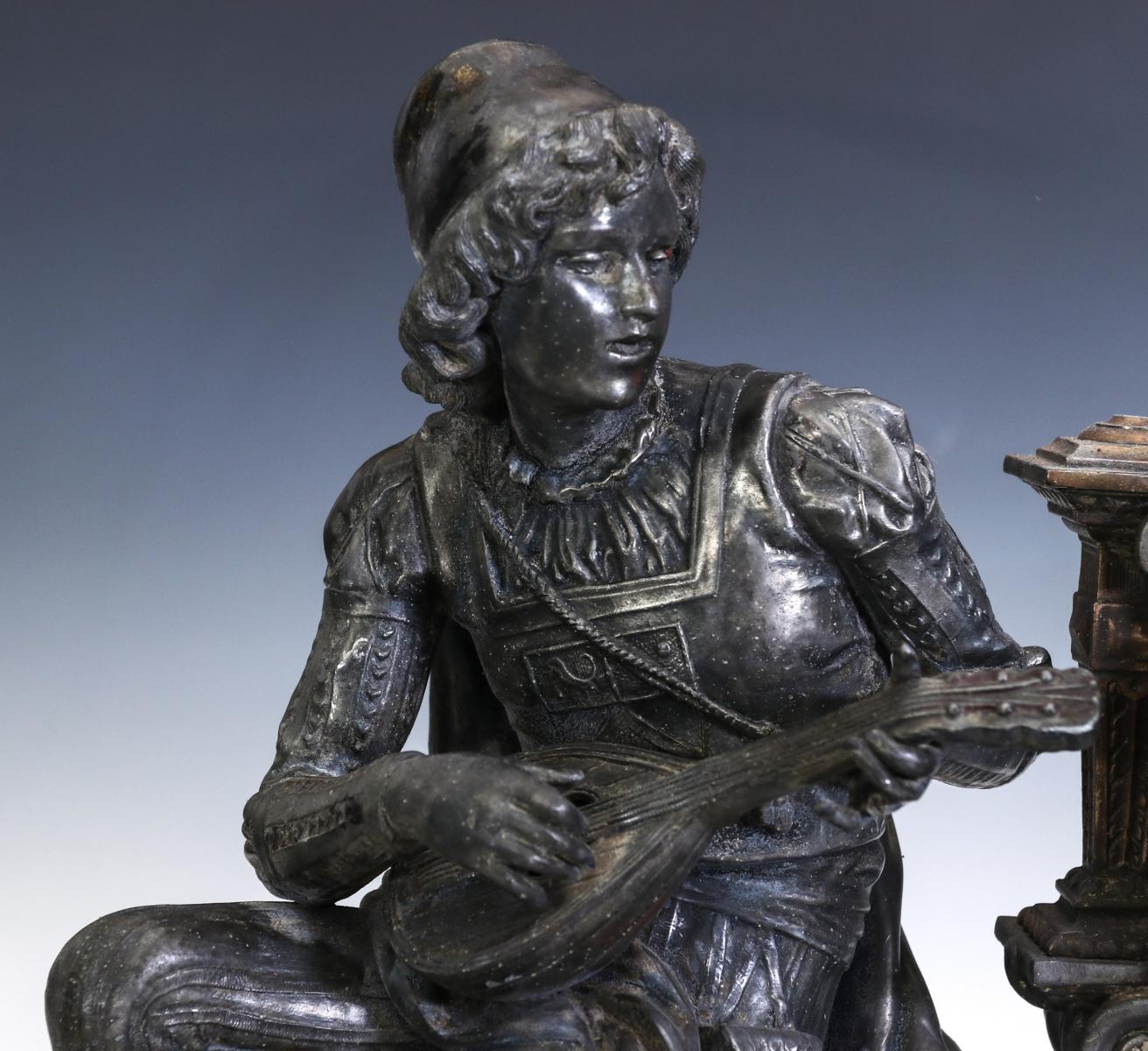 AN ANSONIA SPELTER STATUE CLOCK WITH LUTE PLAYER