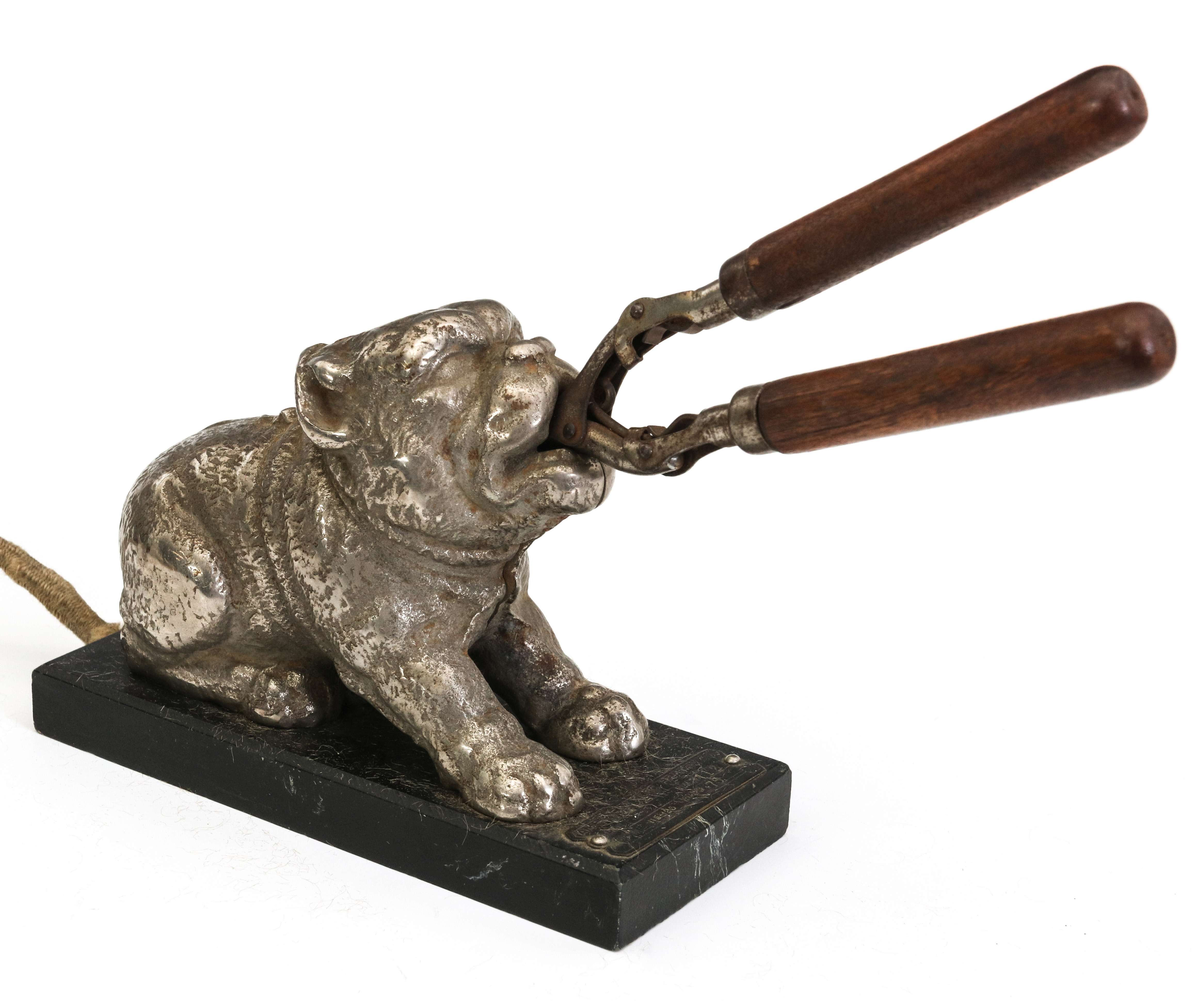 AN EARLY 20TH CENT FIGURAL DOG CURLING IRON HEATER