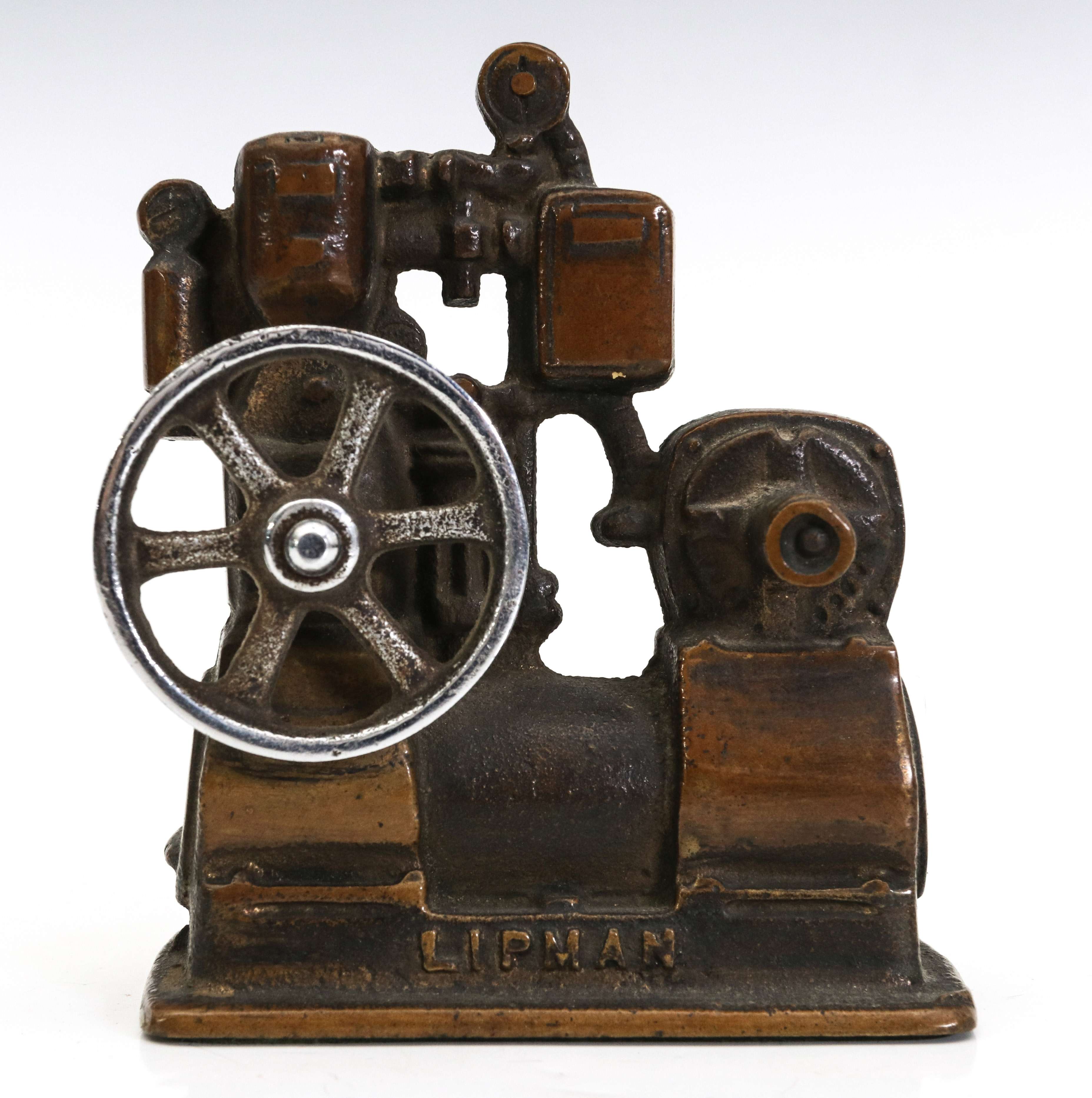 A LIPMAN FIGURAL ENGINE ADVERTISING PAPERWEIGHT