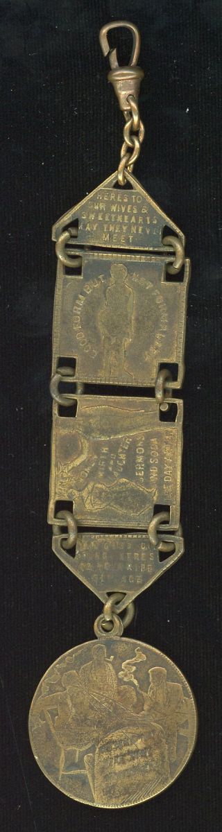 A CIRCA 1900 BRASS WATCH FOB OF MAN'S VICES