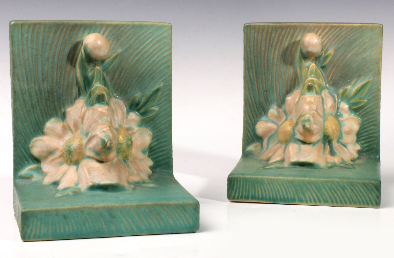 A PAIR OF ROSEVILLE 'PEONY' ART POTTERY BOOKENDS