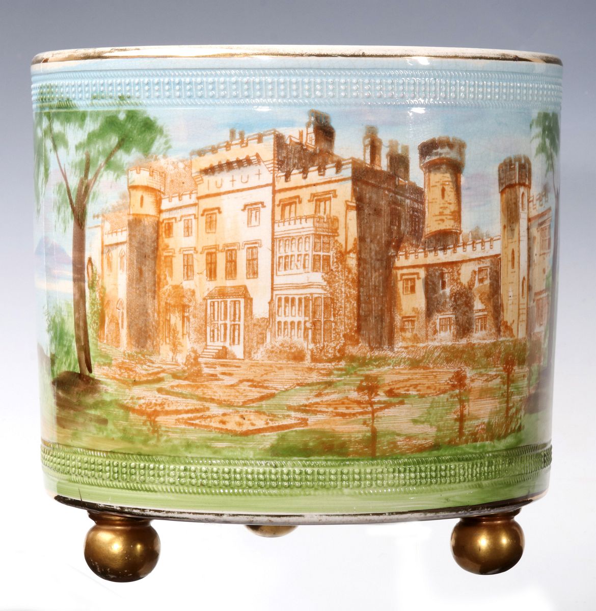 A 19TH CENTURY ENGLISH POTTERY FOOTED JARDINIERE