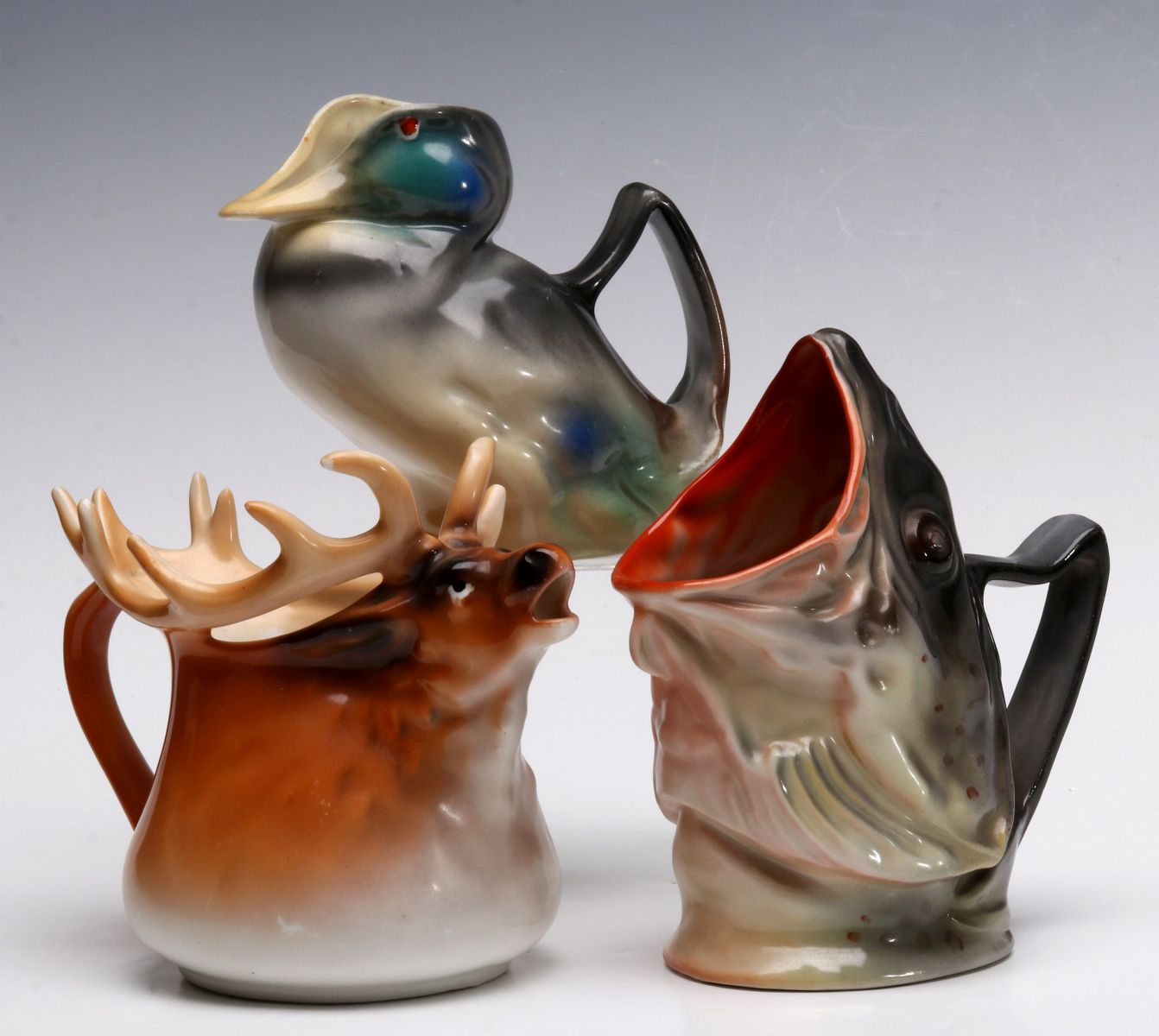 A COLLECTION OF ROYAL BAYREUTH FIGURAL PITCHERS