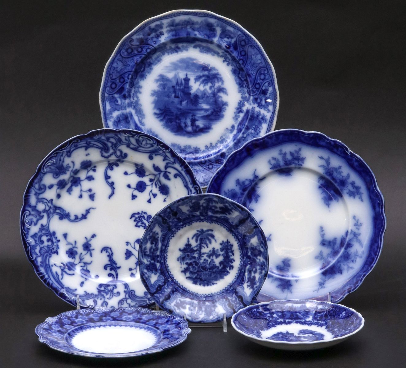 A COLLECTION OF VARIOUS FLOW BLUE PLATES