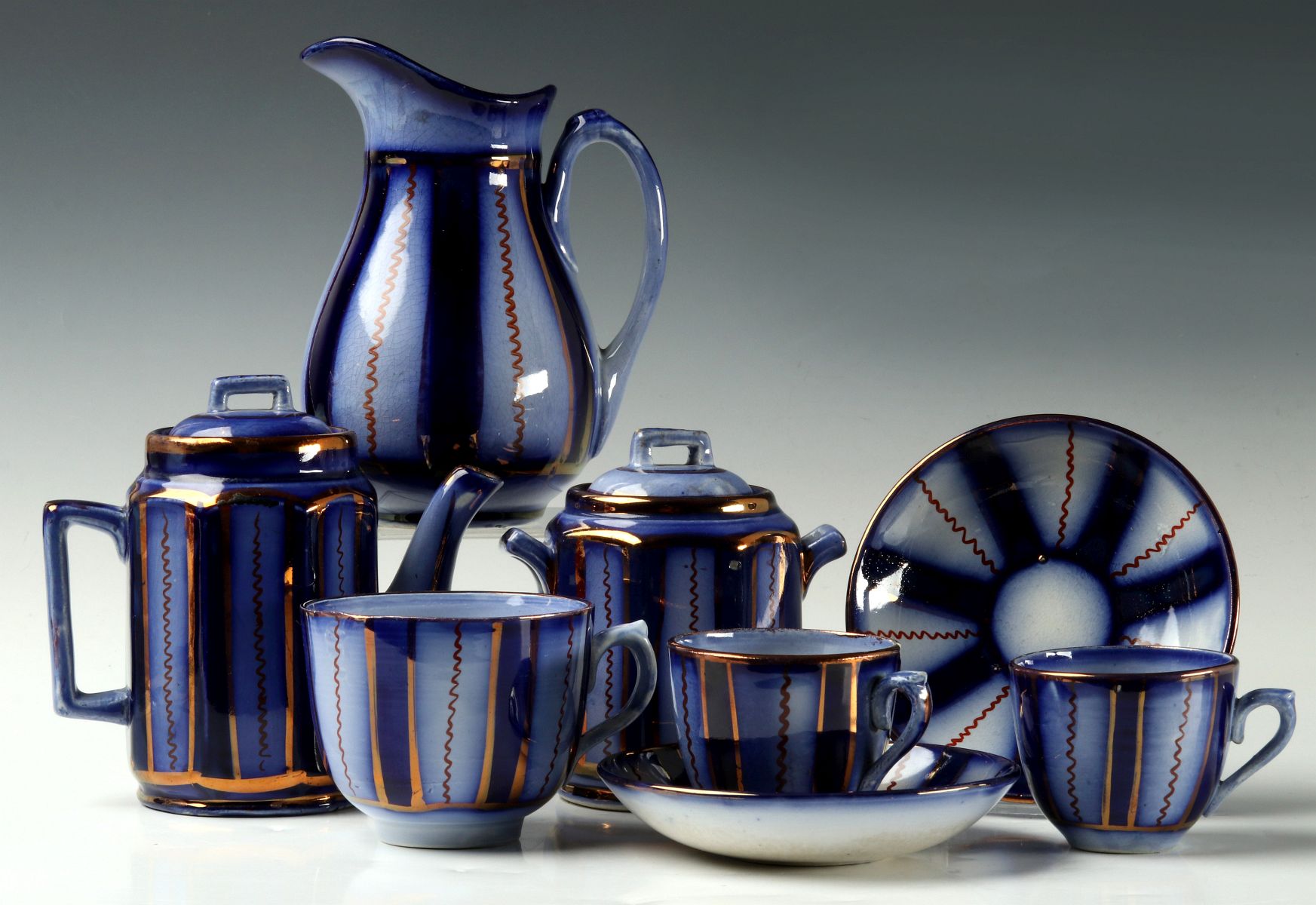 A COLLECTION OF FLOW BLUE COPPER LUSTRE CHINA