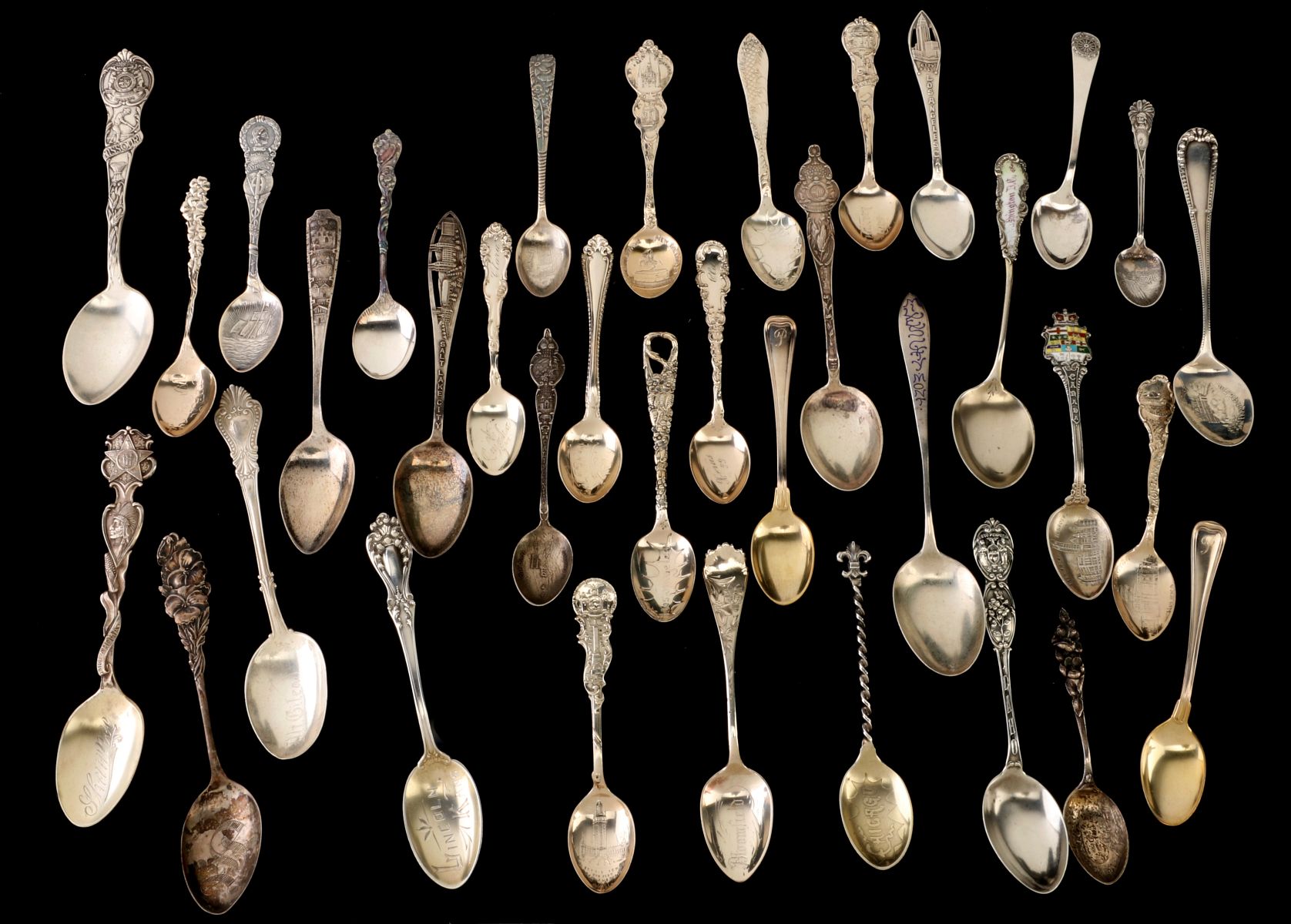 A COLLECTION OF STERLING SILVER SOUVENIR SPOONS