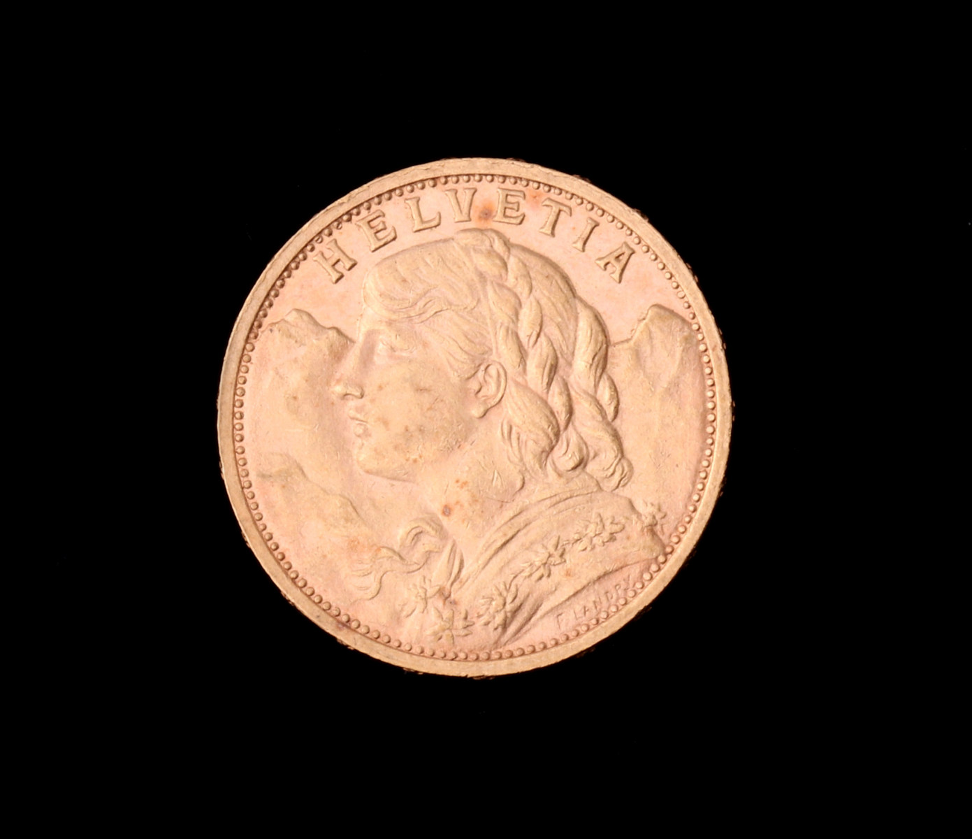 A SWISS 20 FRANC .900 GOLD COIN 1900B