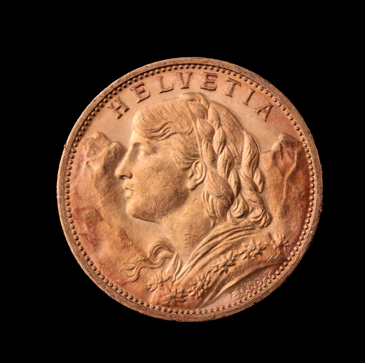 A SWISS 20 FRANC .900 GOLD COIN 1913B