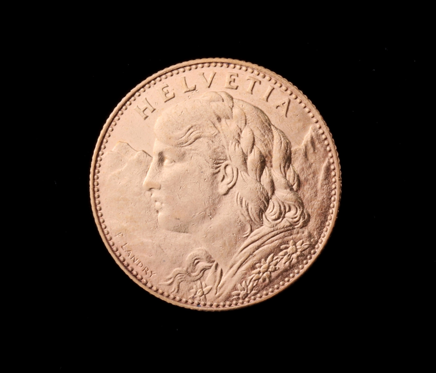 A SWISS 10 FRANC .900 GOLD COIN 1911B