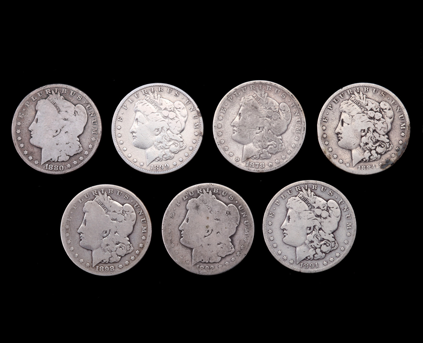 SEVEN MORGAN SILVER DOLLARS 1878-1899