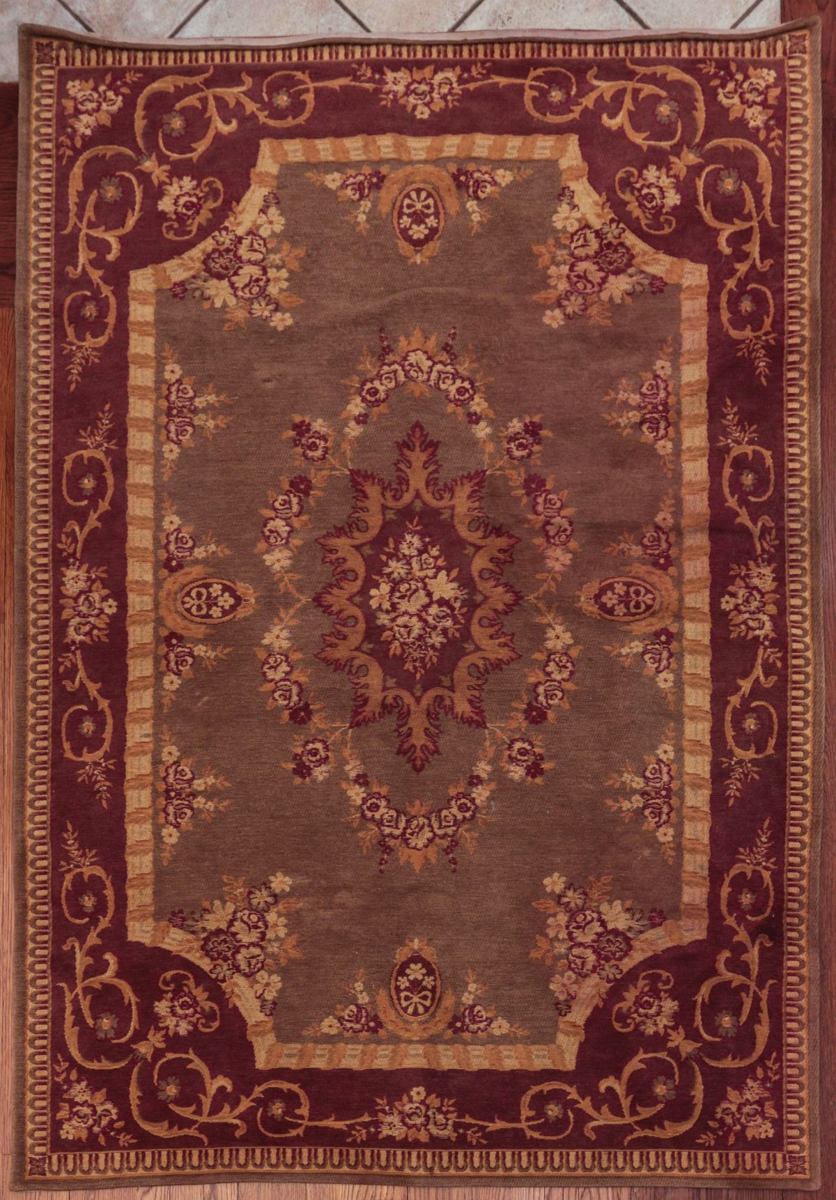 A MACHINE MADE CHENILLE TYPE AREA RUG