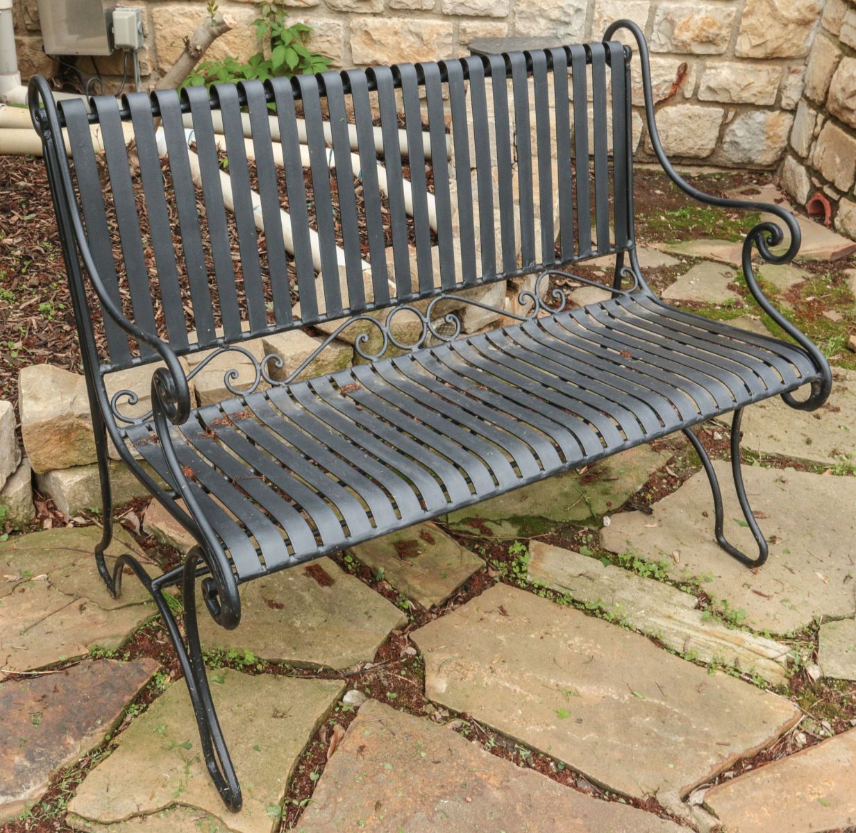 A CONTEMPORARY IRON STRAP WORK GARDEN BENCH