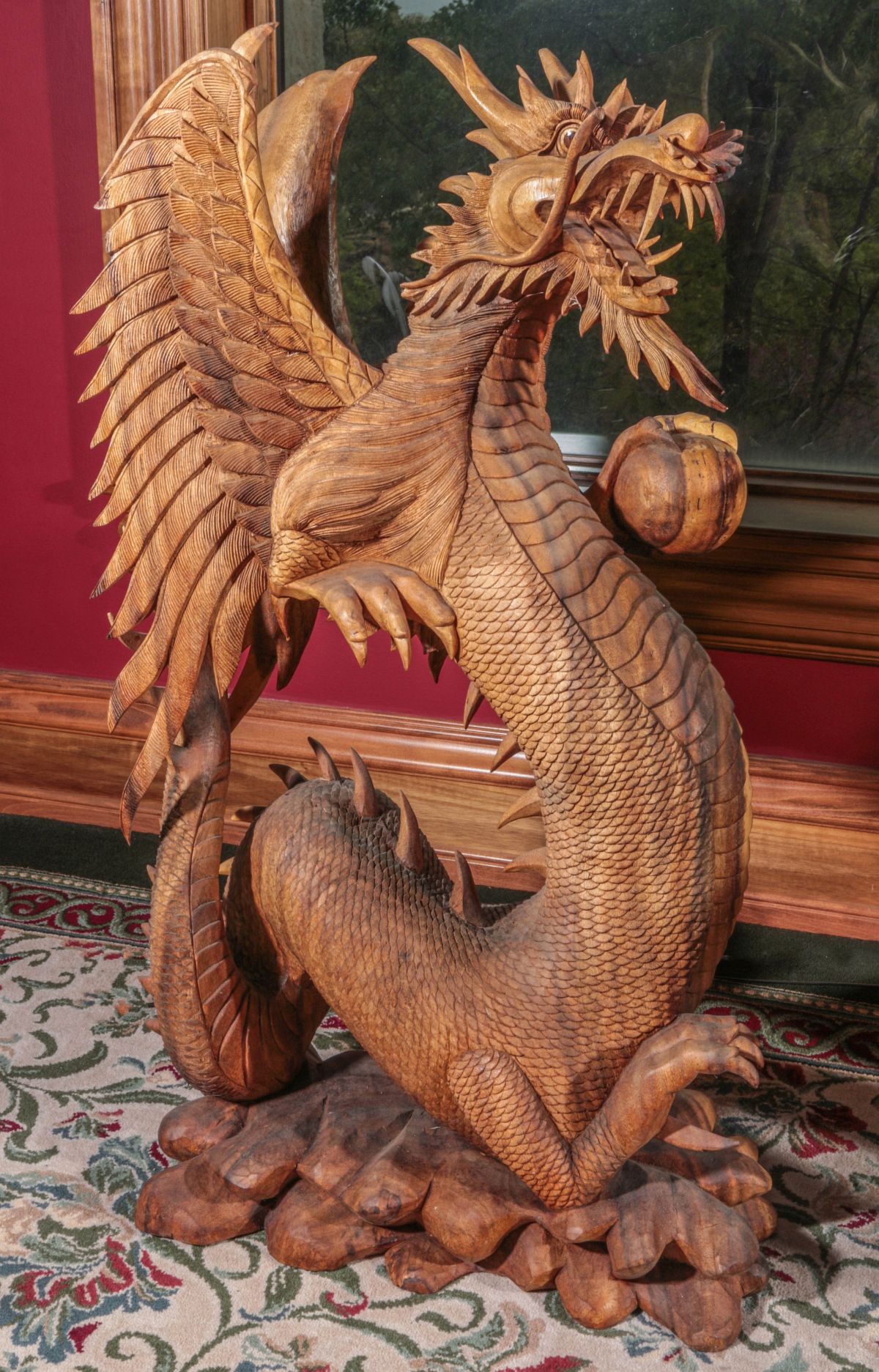 A LARGE AND DETAILED 40-INCH DRAGON WOOD CARVING