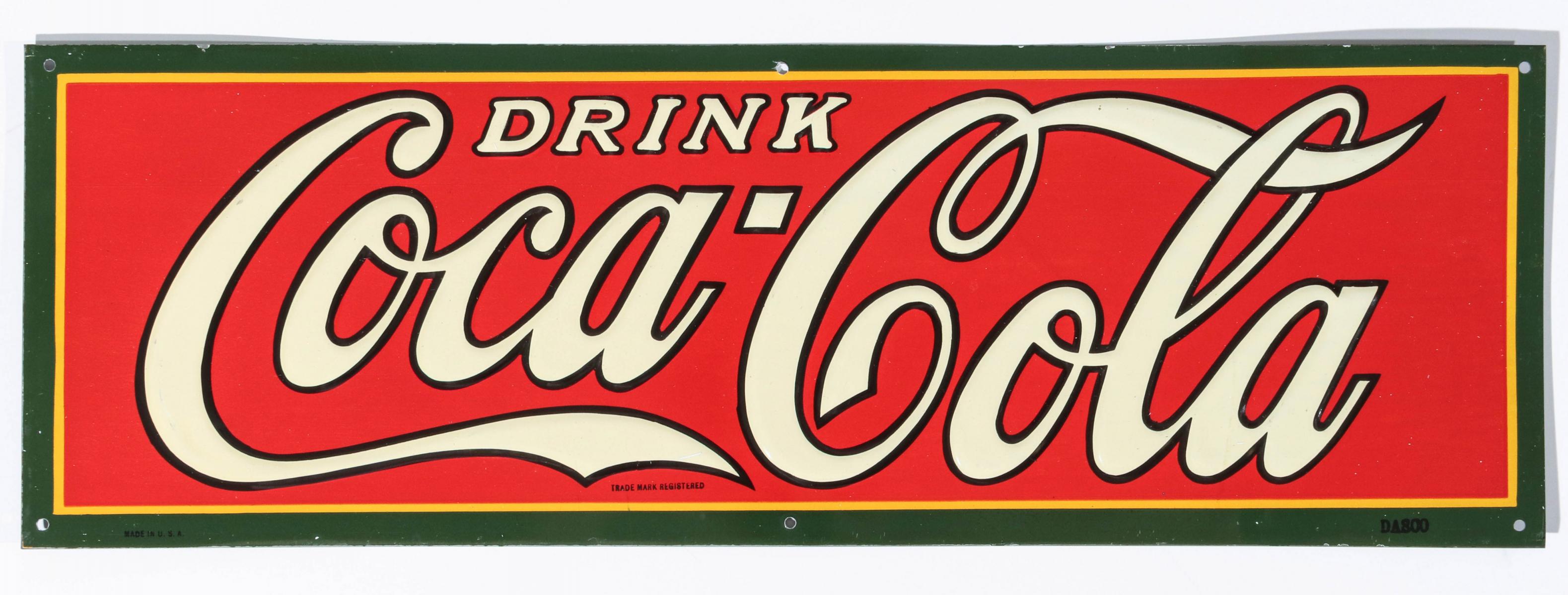 AN EMBOSSED COCA-COLA ADVERTISING SIGN