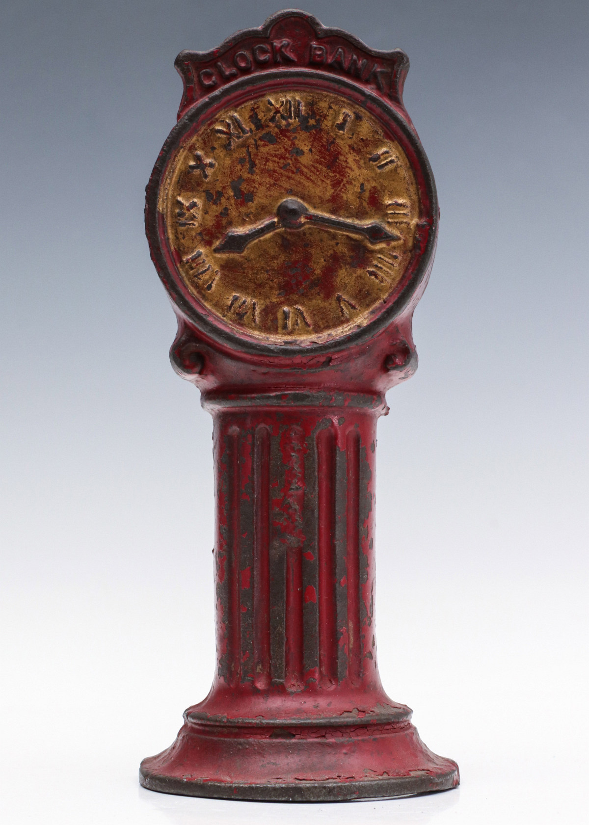 A SCARCE CAST IRON CLOCK BANK ATTRIBUTED TO DENT