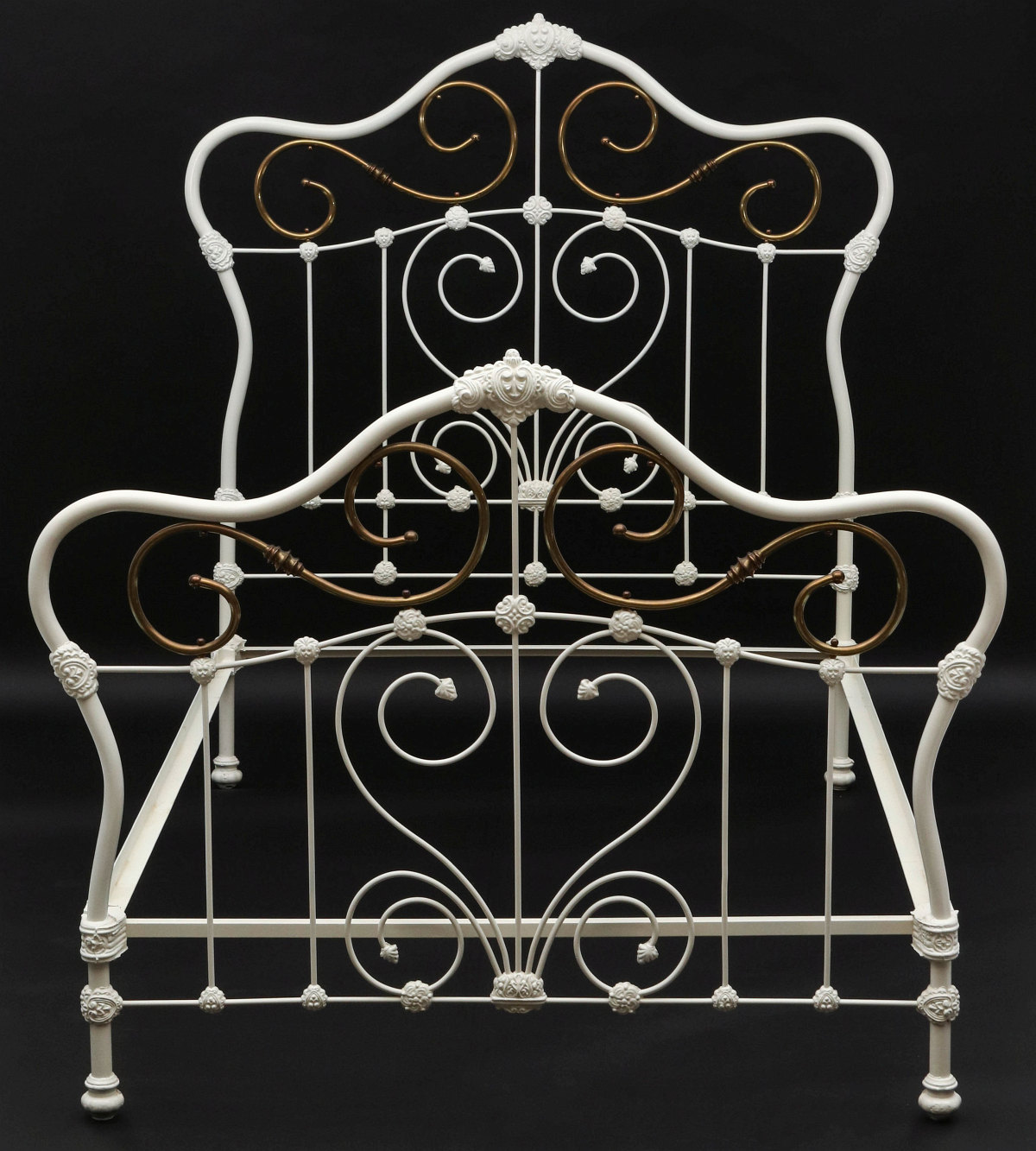 AN EXCEPTIONAL ORNATE IRON BED WITH BRASS EMBELLISHMENT