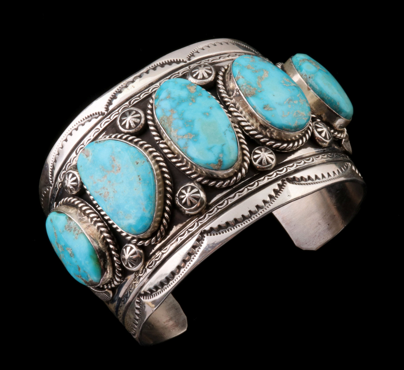 A JOHNNY JOHNSON PATINATED STERLING AND TURQUOISE CUFF