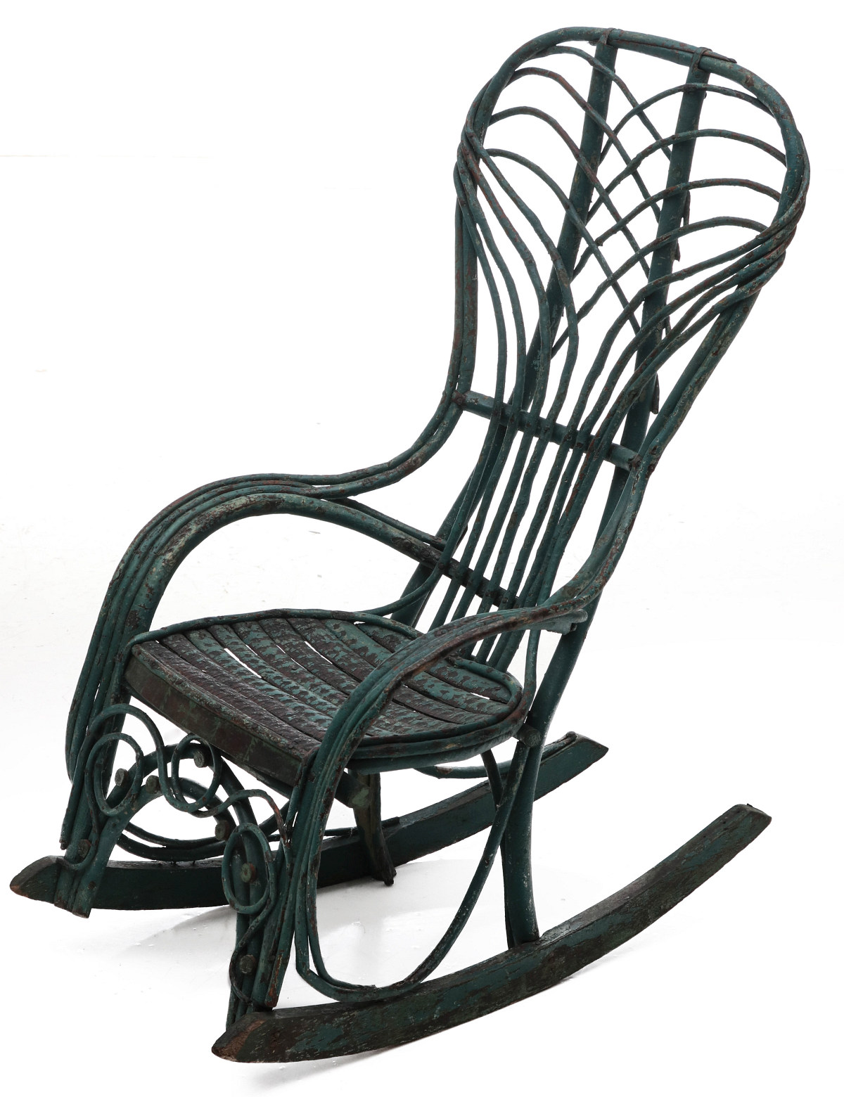 AN INTRICATE CHILD'S TWIG ROCKER IN GREEN WITH ORNAMENT